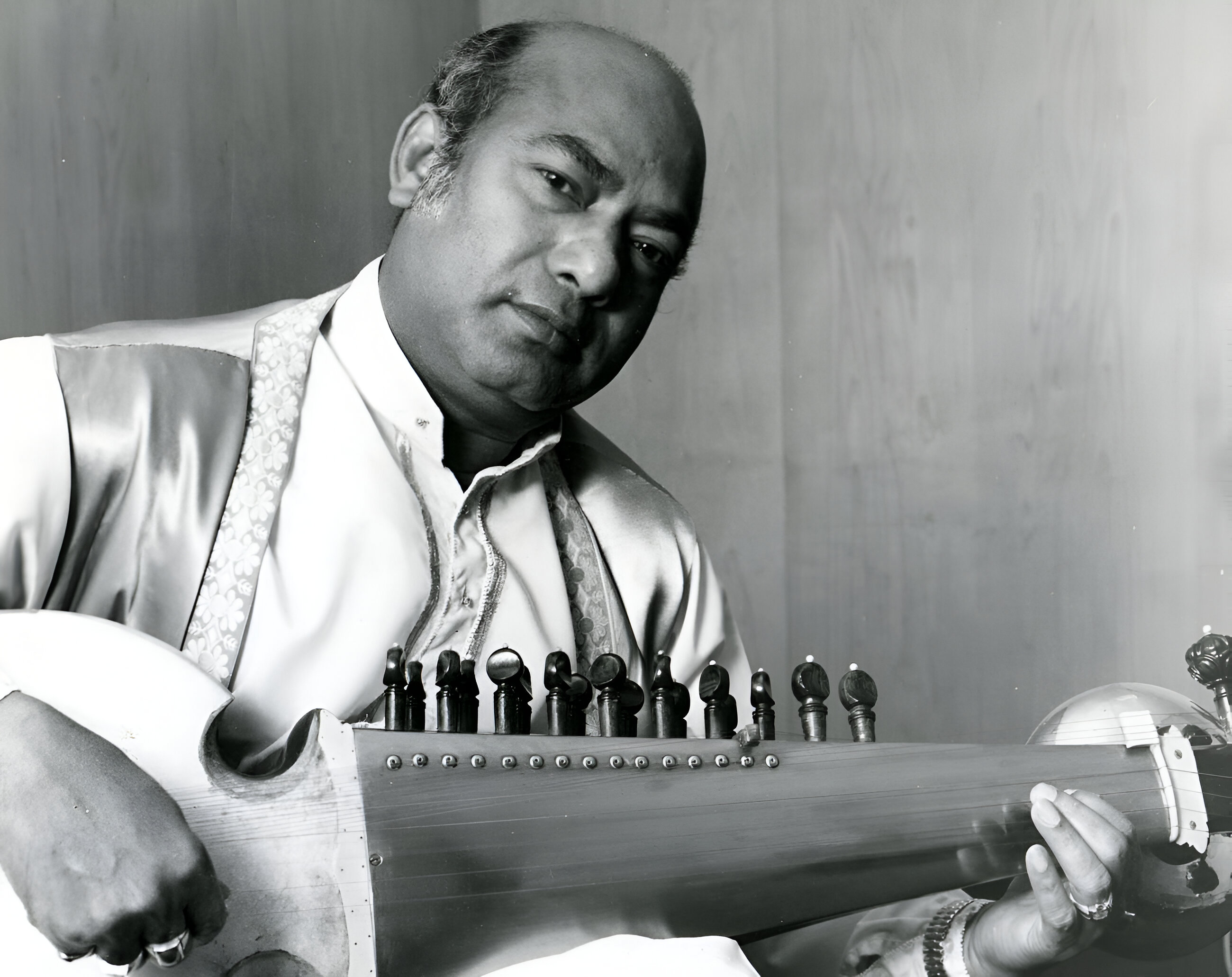 Black and white archival portrait of Ustad Ali Akbar Khan.
