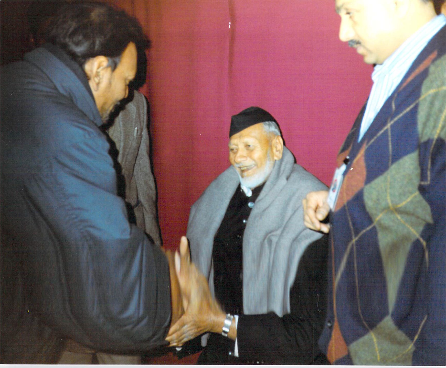 Bismillah Khan seated during a visit to Leicester in 1993.