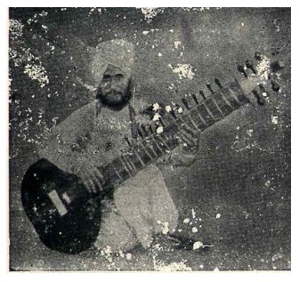 Seated man in a turban holding a sitar, a damaged early print